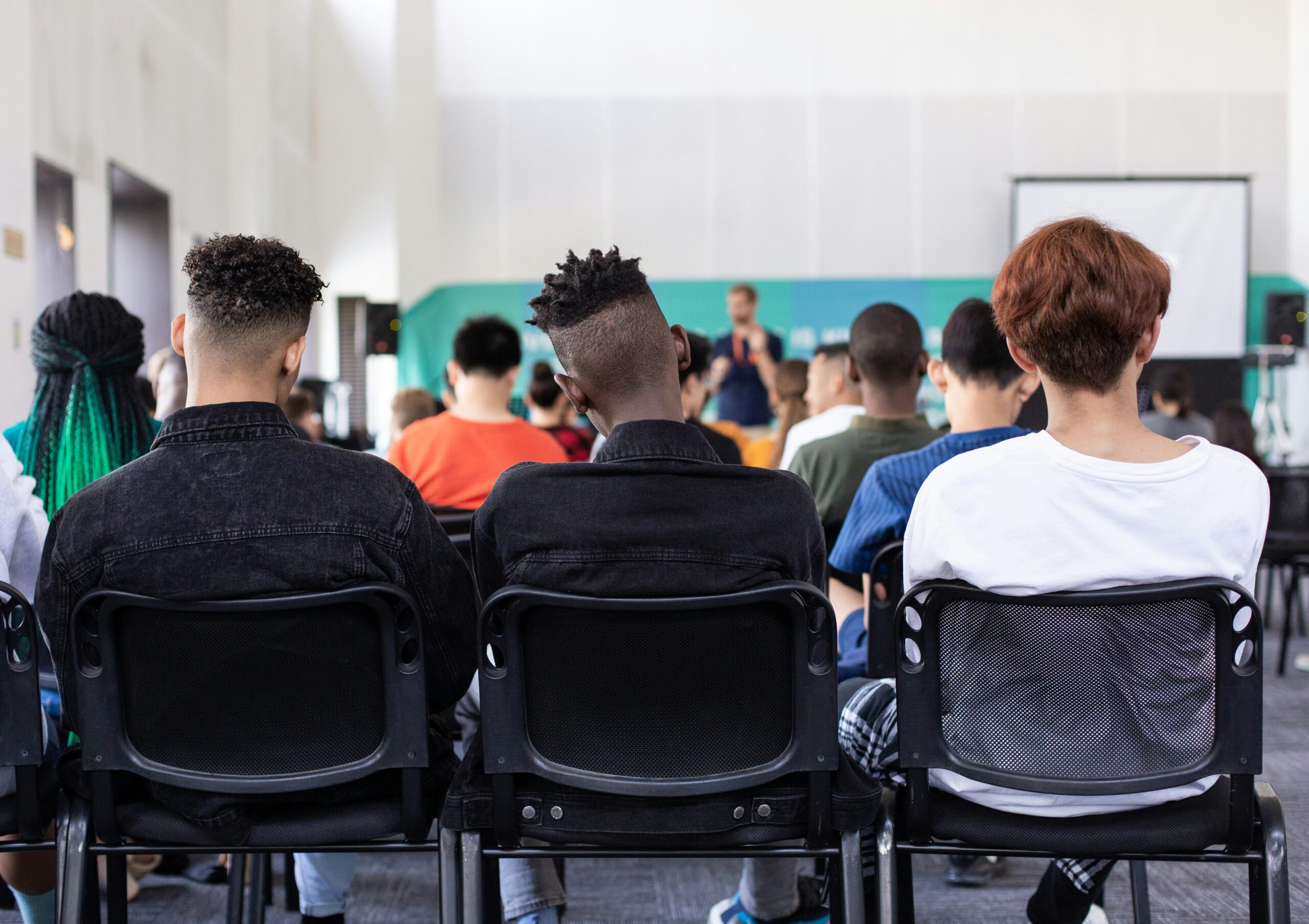 Teenagers in classroom discussing mental health