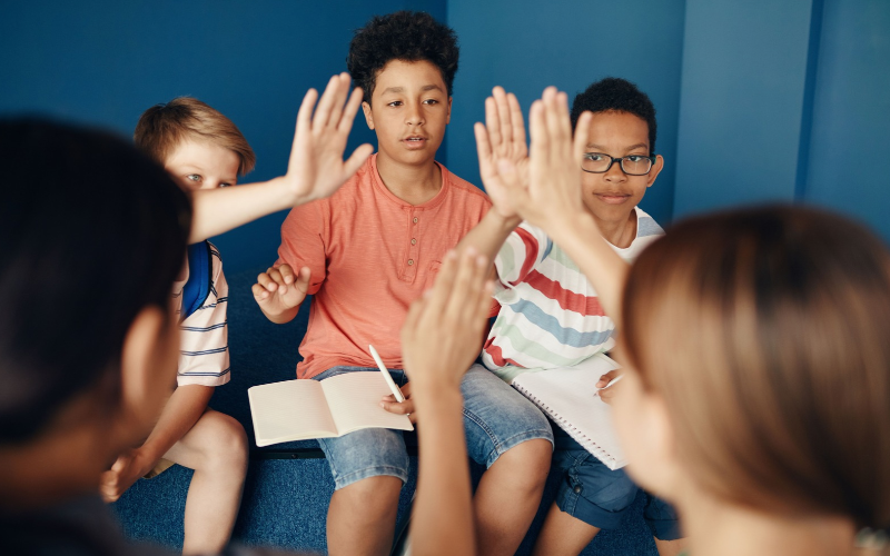 Group of young people including each other in a group exercise